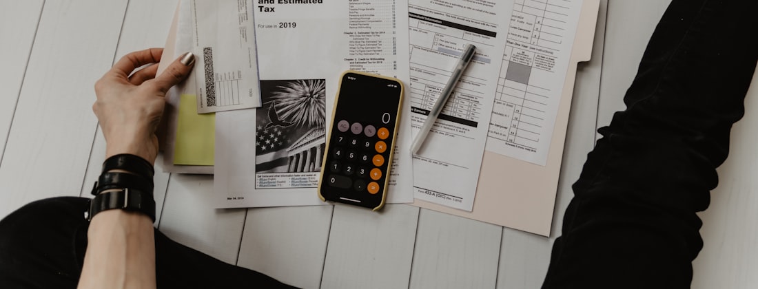 Paperwork, receipts and a calculator on a desk