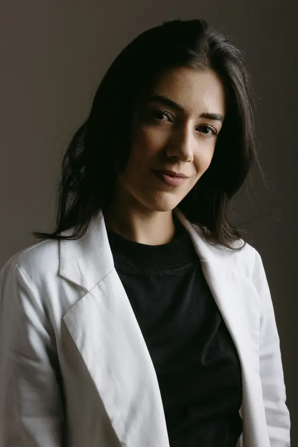 Dr Nadia Rahman, a practitioner in a white coat
